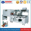 Shrink wrapping machine for carton box
